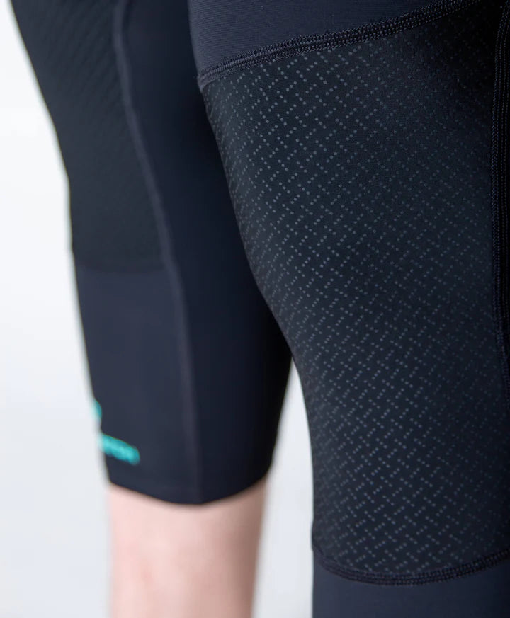 Close-up of dark blue athletic shorts with a textured pattern on a white background