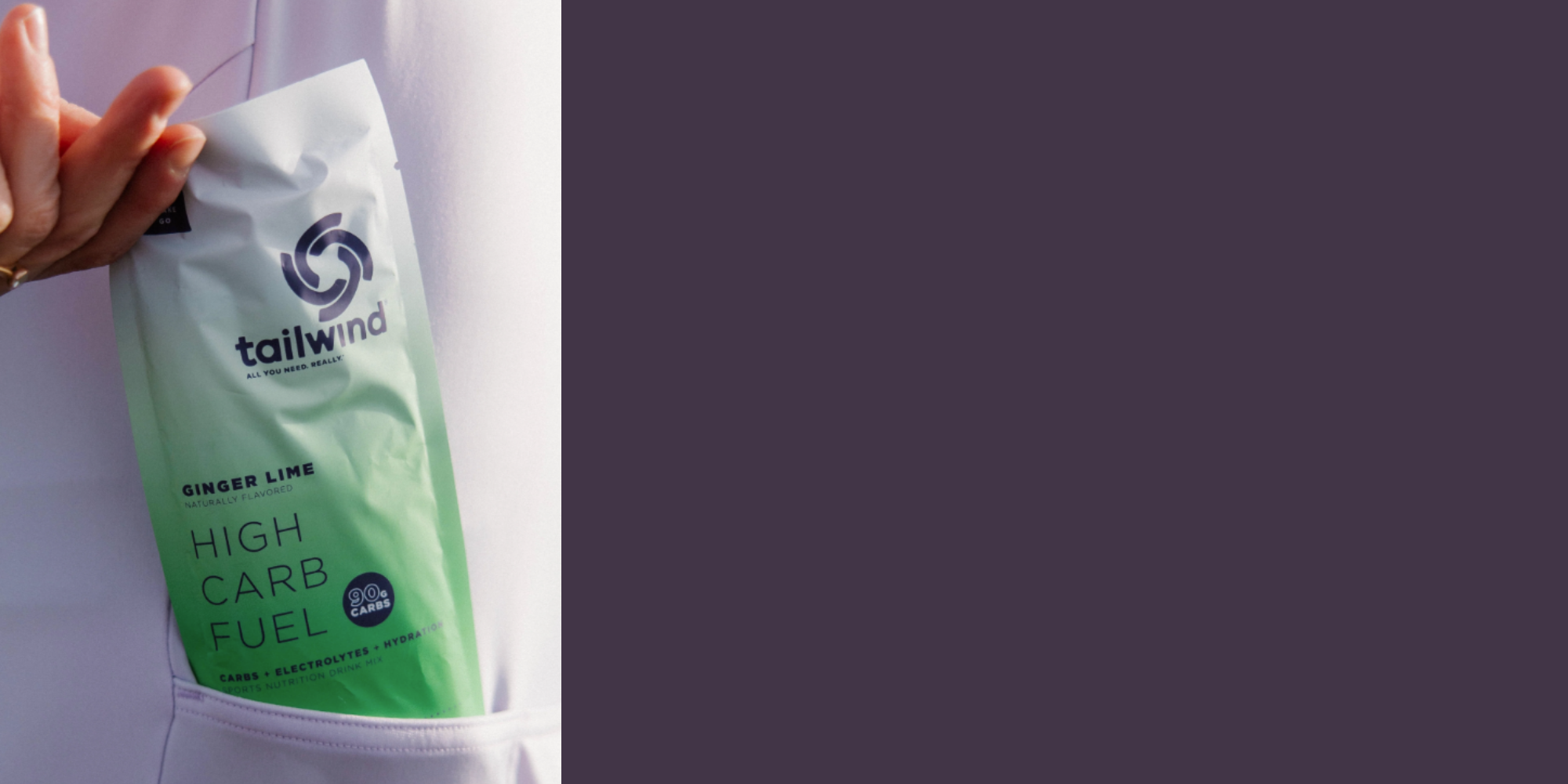 Green bag labeled 'High Carb Fuel' held by a person with a plain background