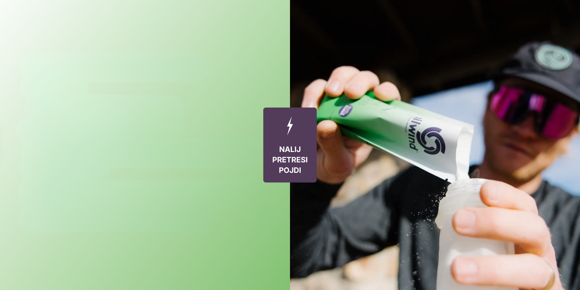 Person holding a green and white bottle with a label, against a green background