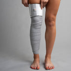 bandage wrap grey applying on leg incrediwear