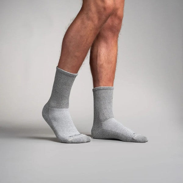 Gray circulation crew socks worn by a person on a plain background