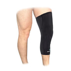 Black leg sleeve on a person's leg with a white background