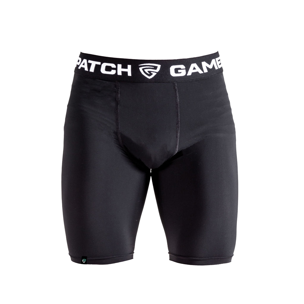 Black compression shorts with a visible brand logo on a white background