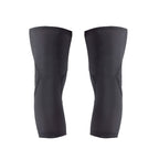 Pair of black knee pads on a white background