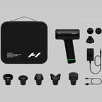 Black handheld device with attachments and carrying case on a gray background
