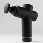 Black massage gun with Hyperice branding on a light gray background