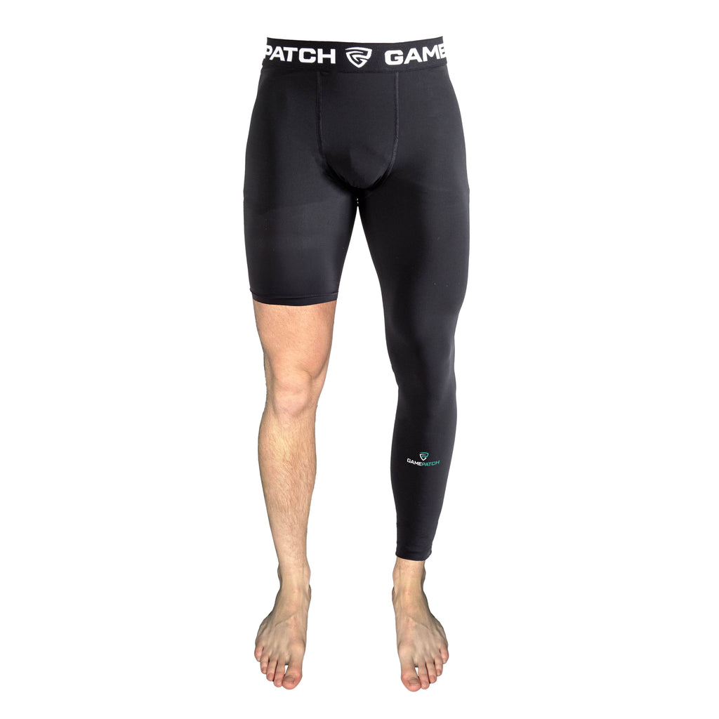 Black compression shorts with visible branding on a white background