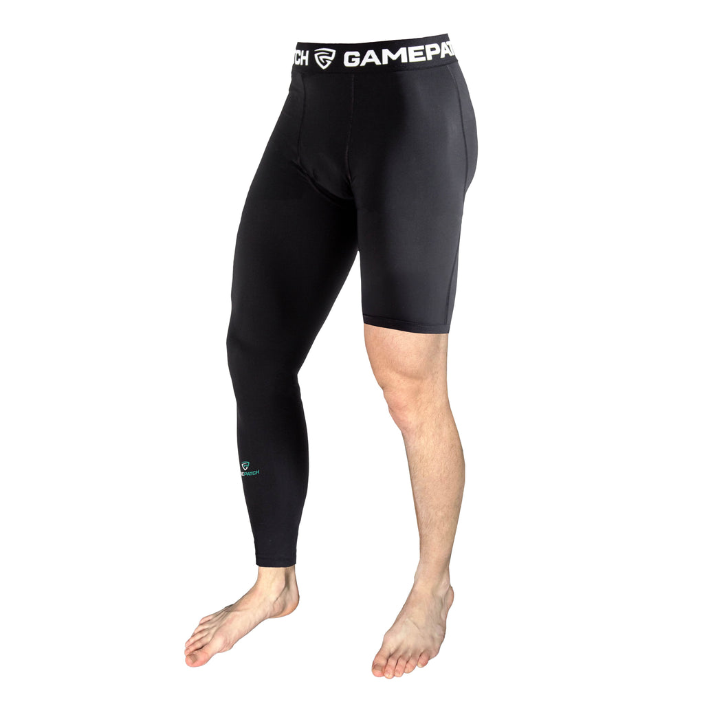 Black compression shorts with visible branding on a white background