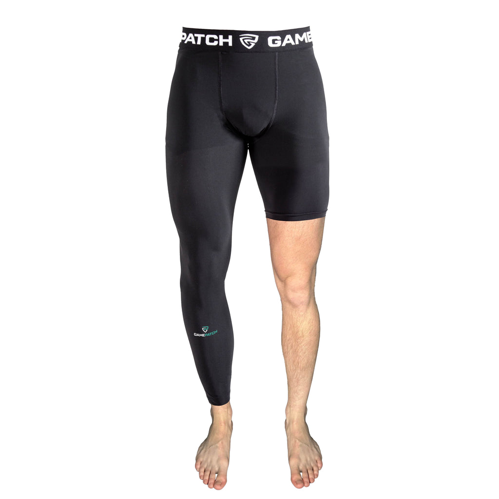Black compression shorts with visible branding on a white background